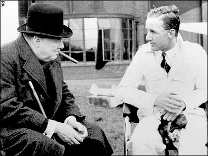 Alex Henshaw chatting with prime minister Winston Churchill about the Spitfire